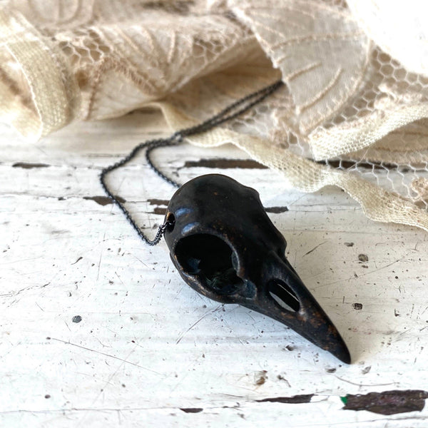 'Bird skull' necklace black | Bronze