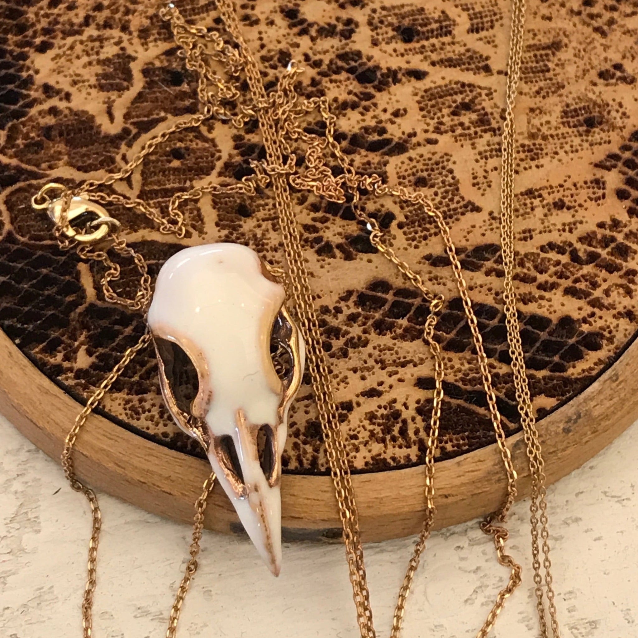 'Bird skull' white necklace | Bronze